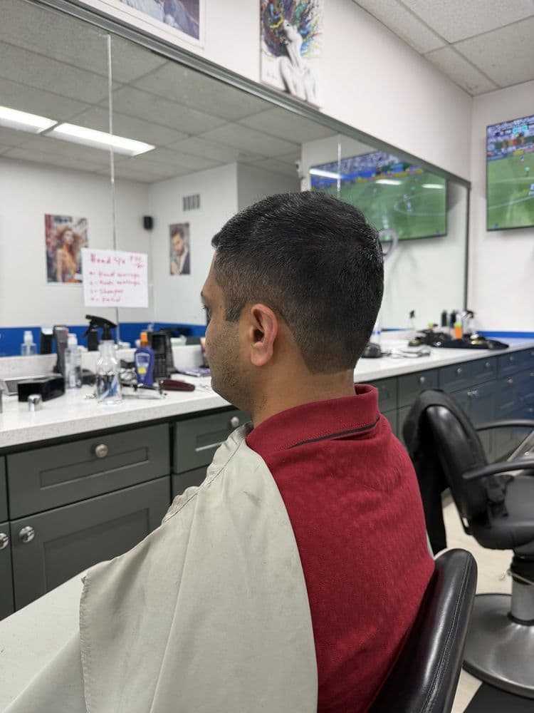 Men's short haircut with a clean tapered neckline at Dimension Hair Salon in Bothell