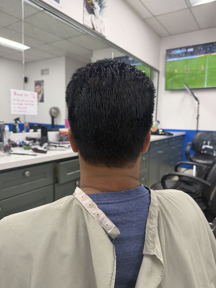 Back view of a men's clean short haircut at Dimension Hair Salon