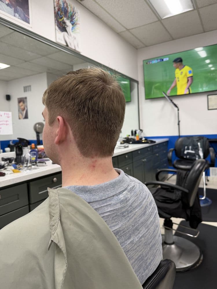 Men's light brown taper haircut completed at Dimension Hair Salon in Bothell