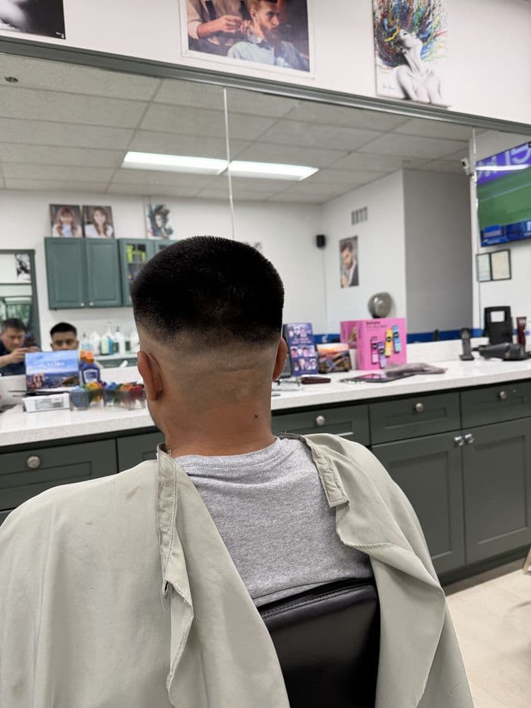 Men's short crop haircut with a blended fade at Dimension Hair Salon