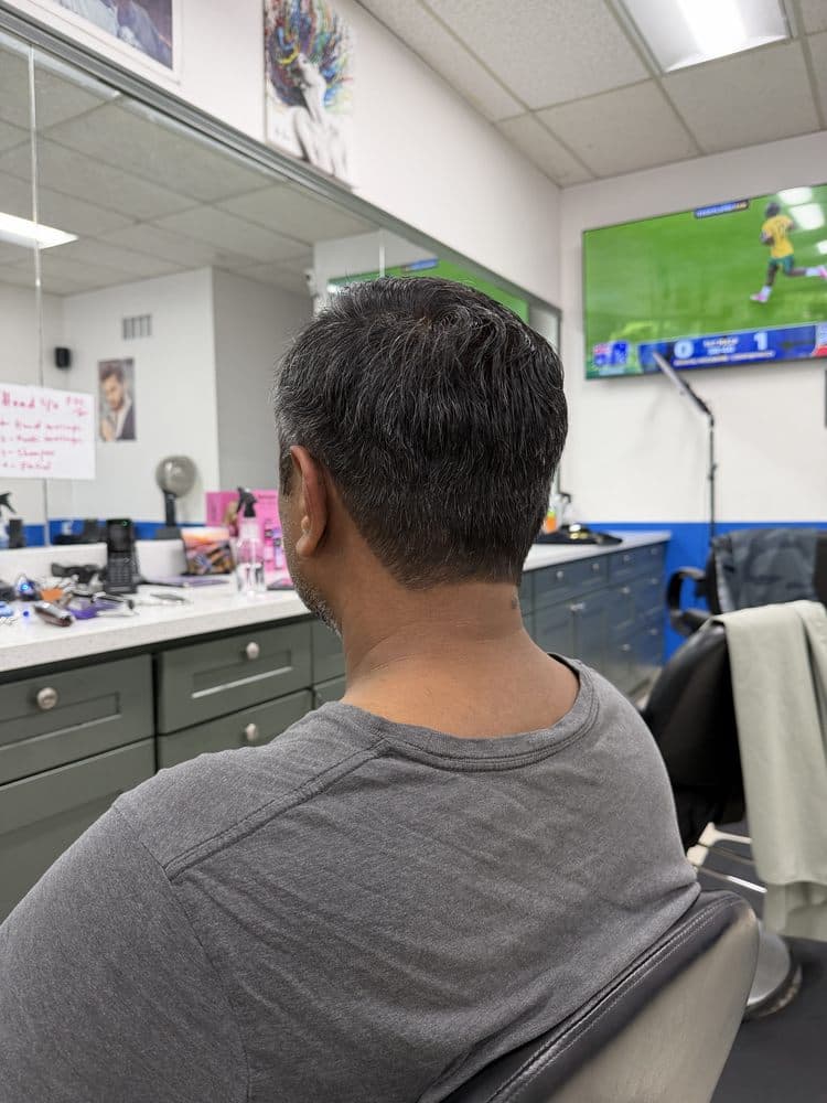 Men's neatly blended short haircut at Dimension Hair Salon in Bothell
