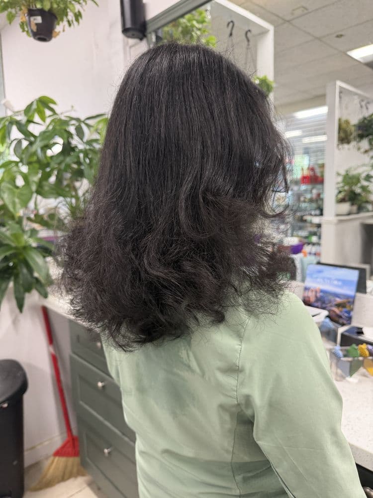 Dark layered hair styled at Dimension Hair Salon in Bothell