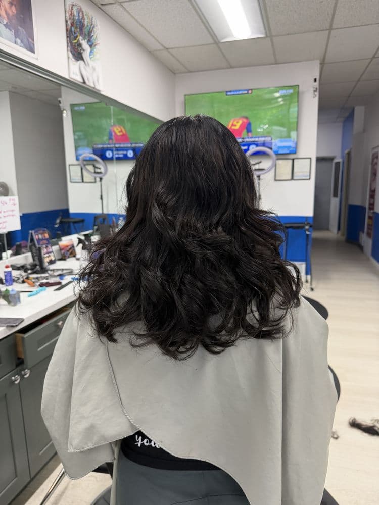 Long layered haircut styled at Dimension Hair Salon in Bothell, Washington