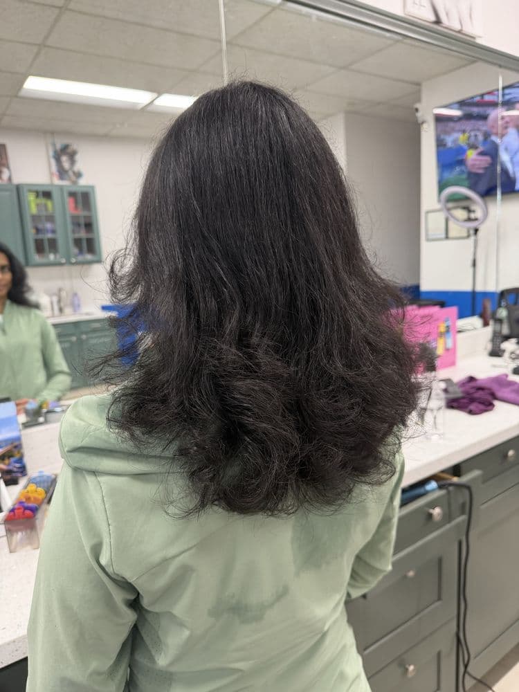 Voluminous long layered hairstyle at Dimension Hair Salon in Bothell