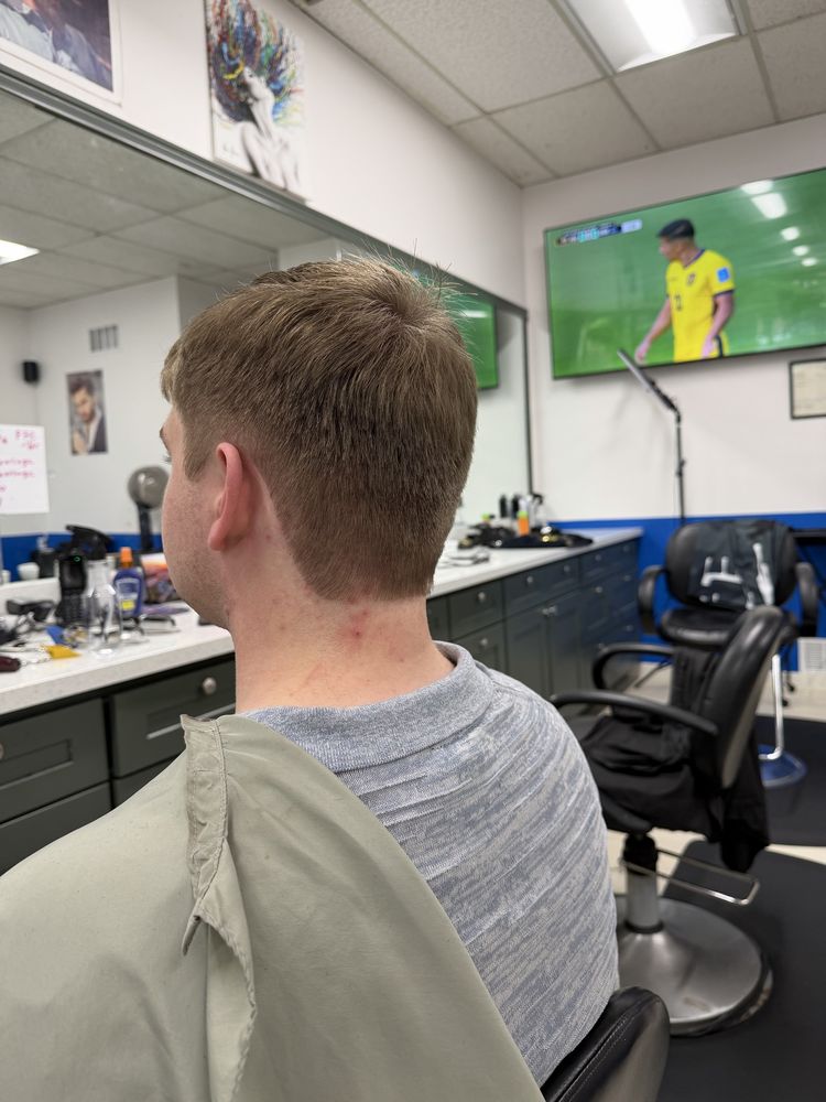 Men's light brown taper haircut completed at Dimension Hair Salon in Bothell