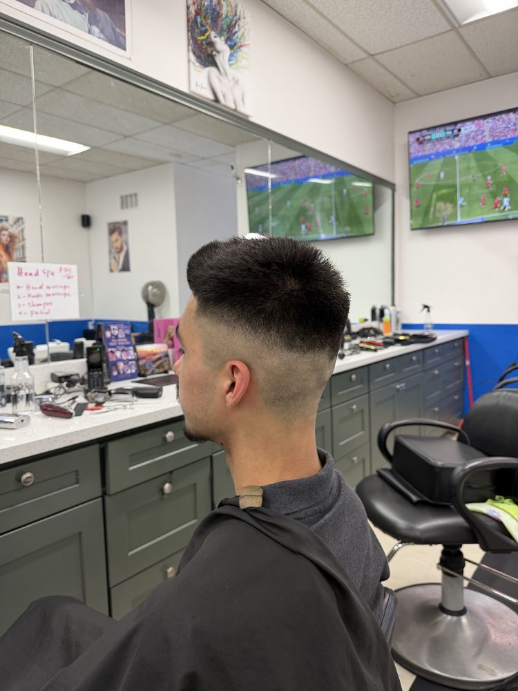 Men's skin fade and textured haircut completed at Dimension Hair Salon in Bothell