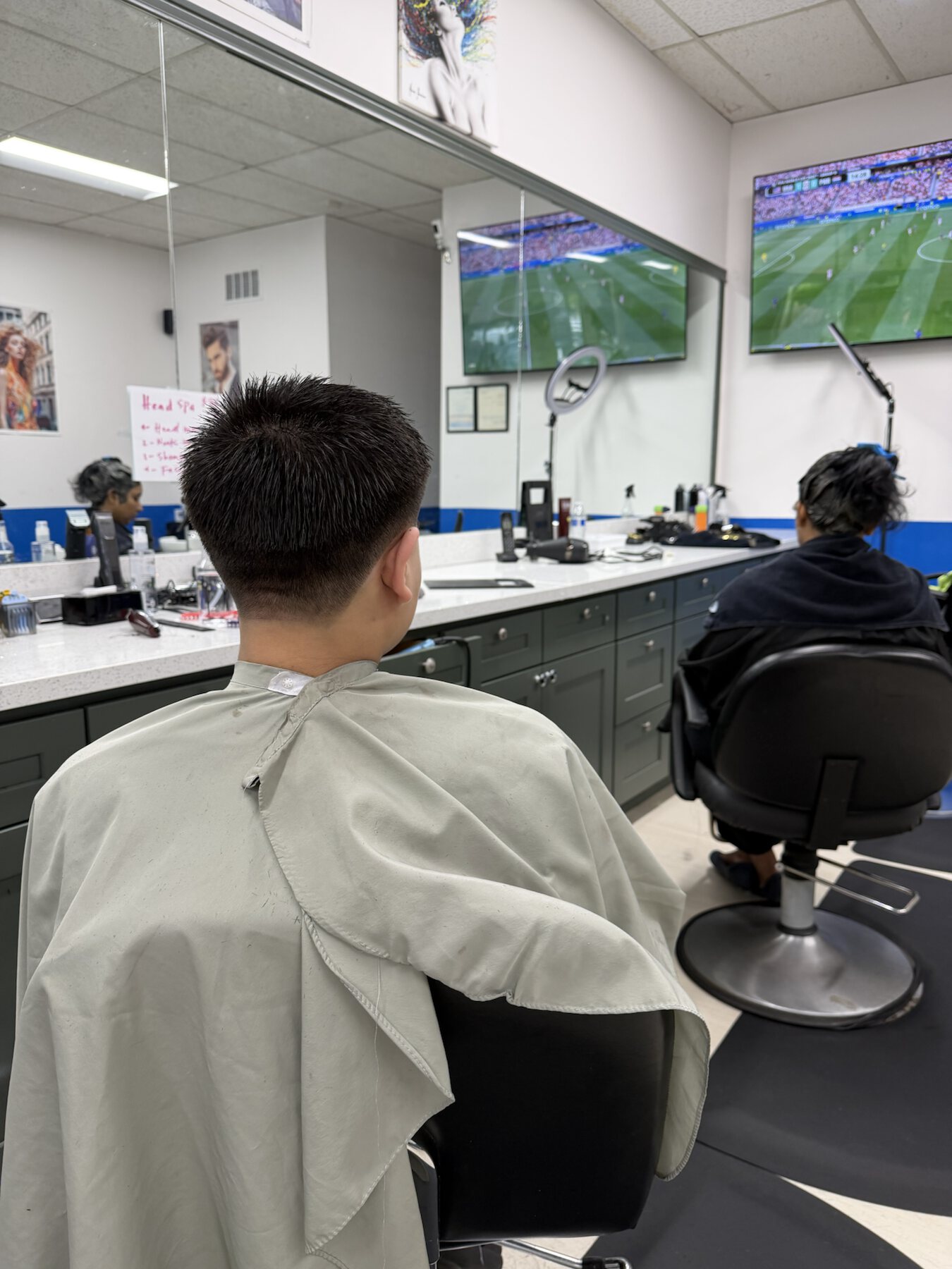 Fresh men's classic taper haircut in the styling chair