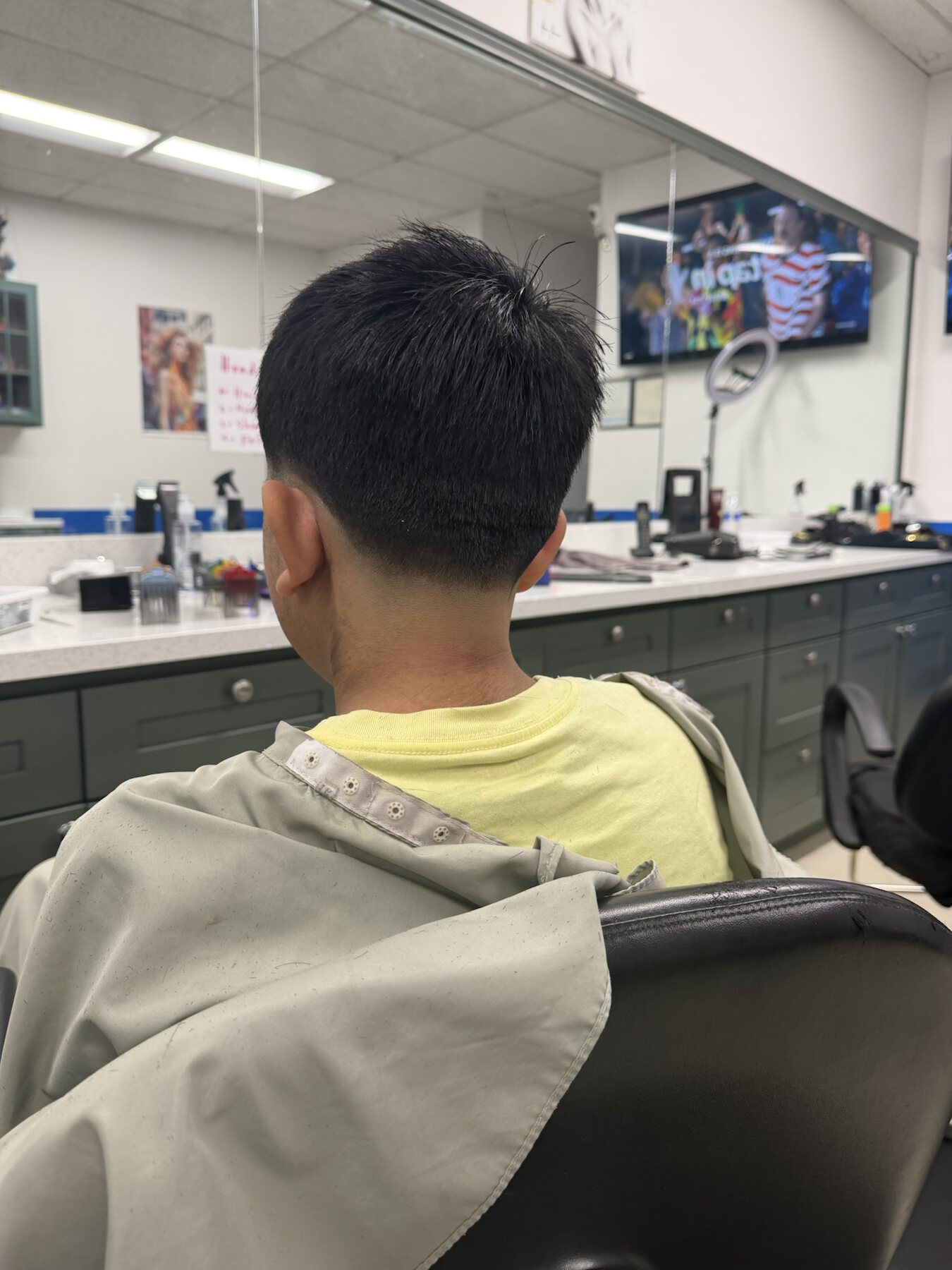 Men's clean taper haircut shown from the back