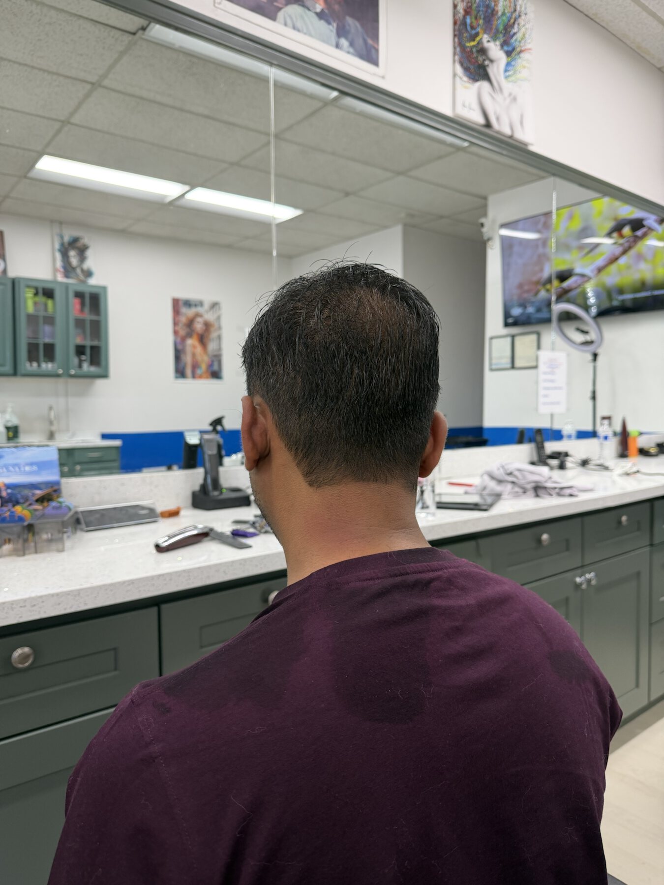 Back view of a men's close short haircut