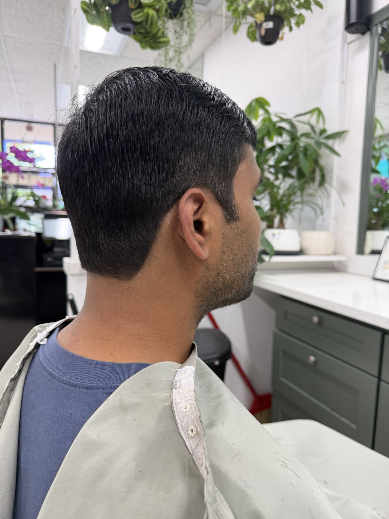 Men's natural short haircut with a tidy side profile