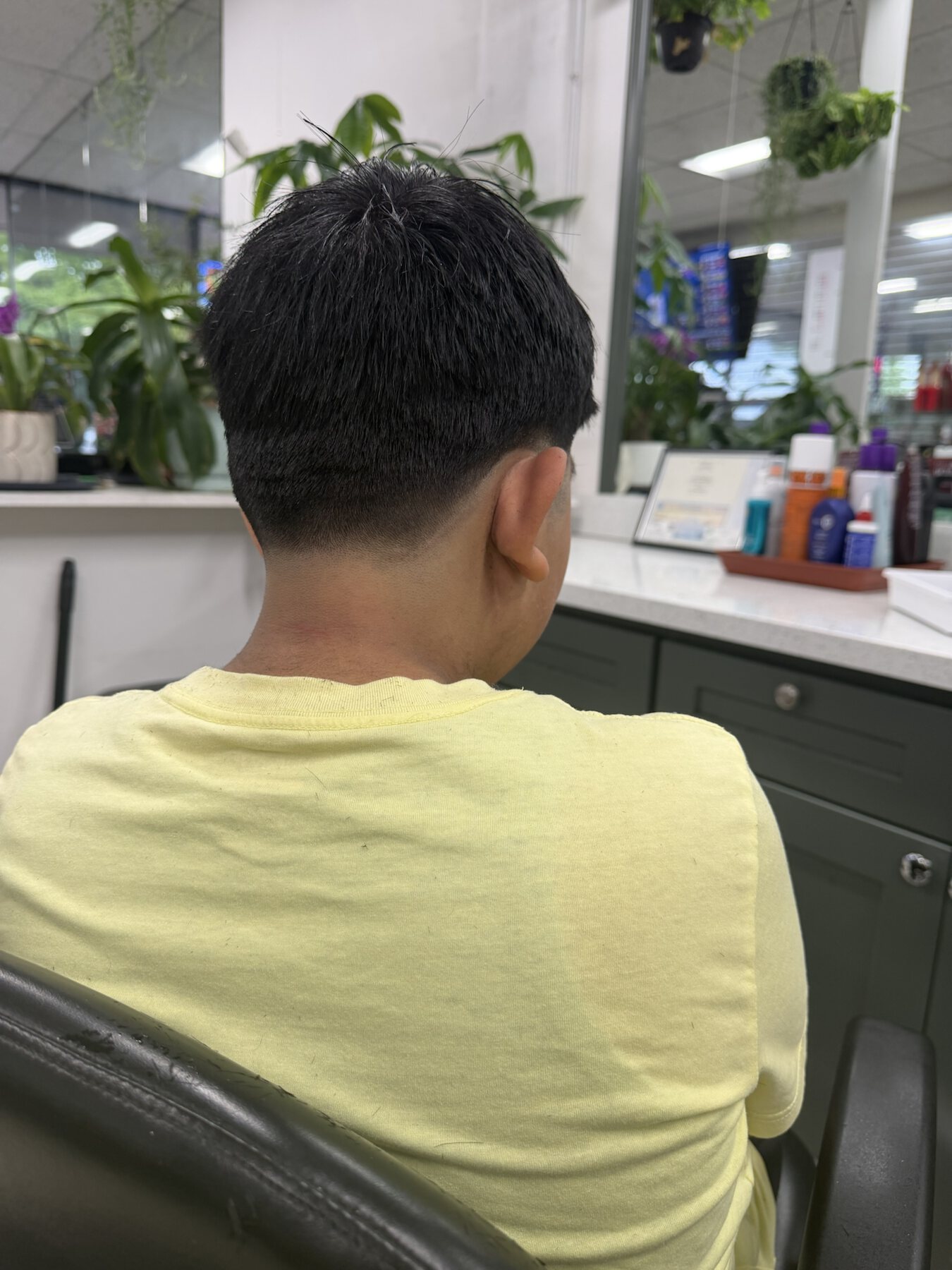 Finished men's short taper haircut at Dimension Hair Salon