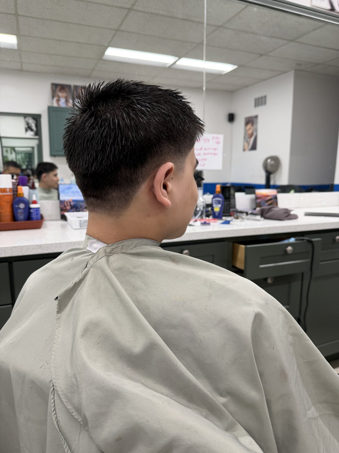 Side view of a fresh men's short taper haircut