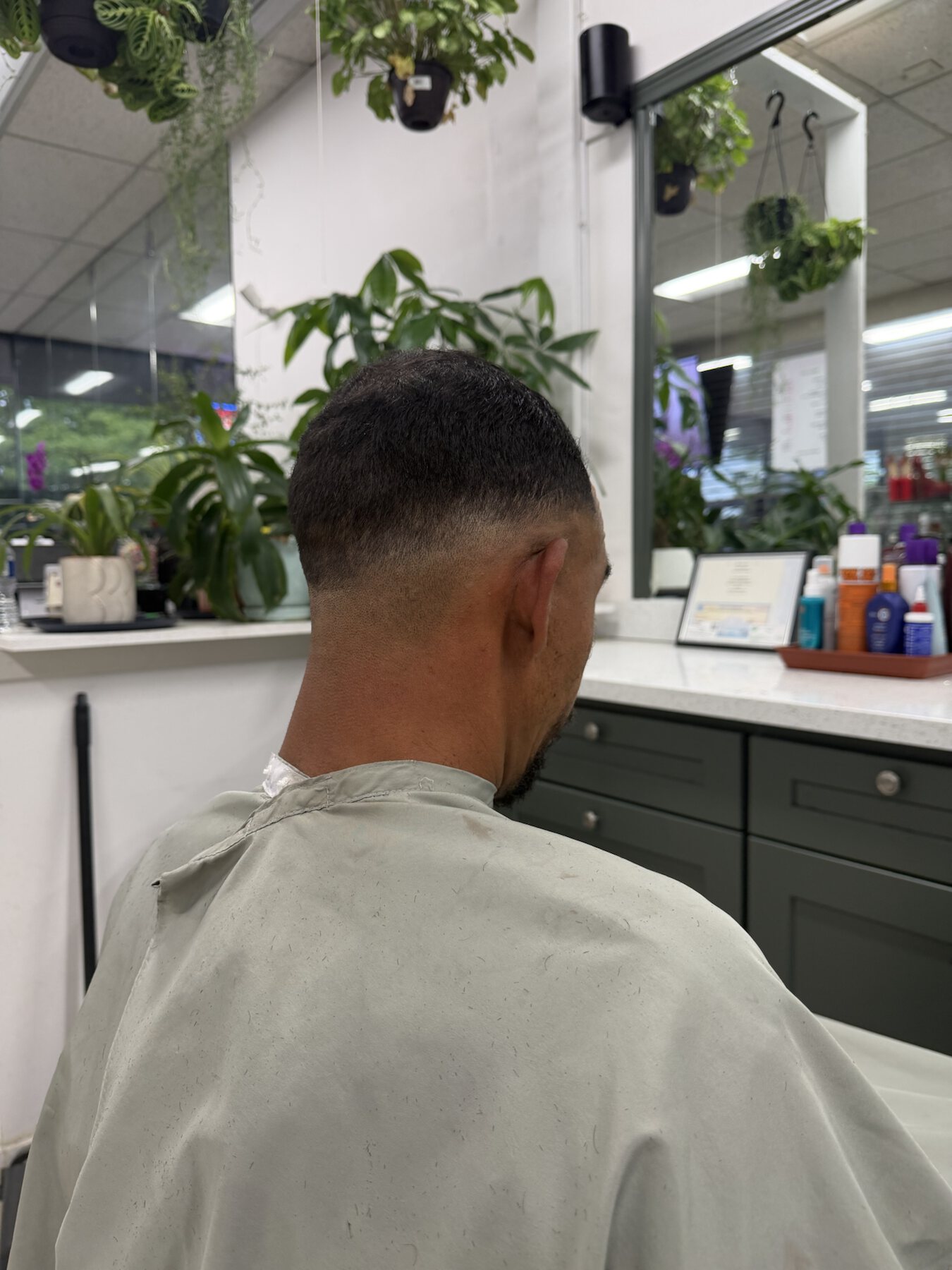 Back of a freshly blended skin fade haircut completed at Dimension Hair Salon