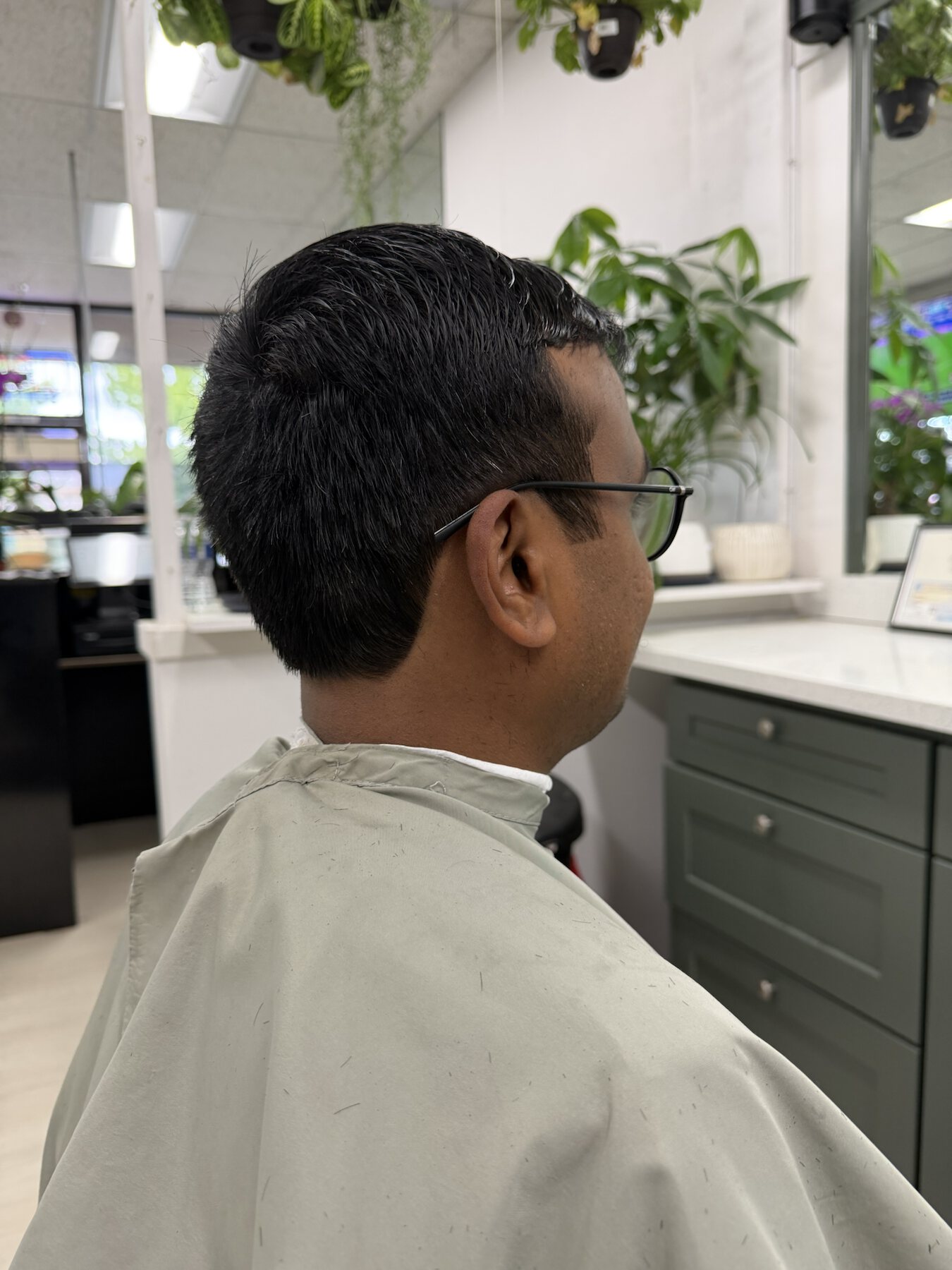 Men's textured short haircut with a natural side finish